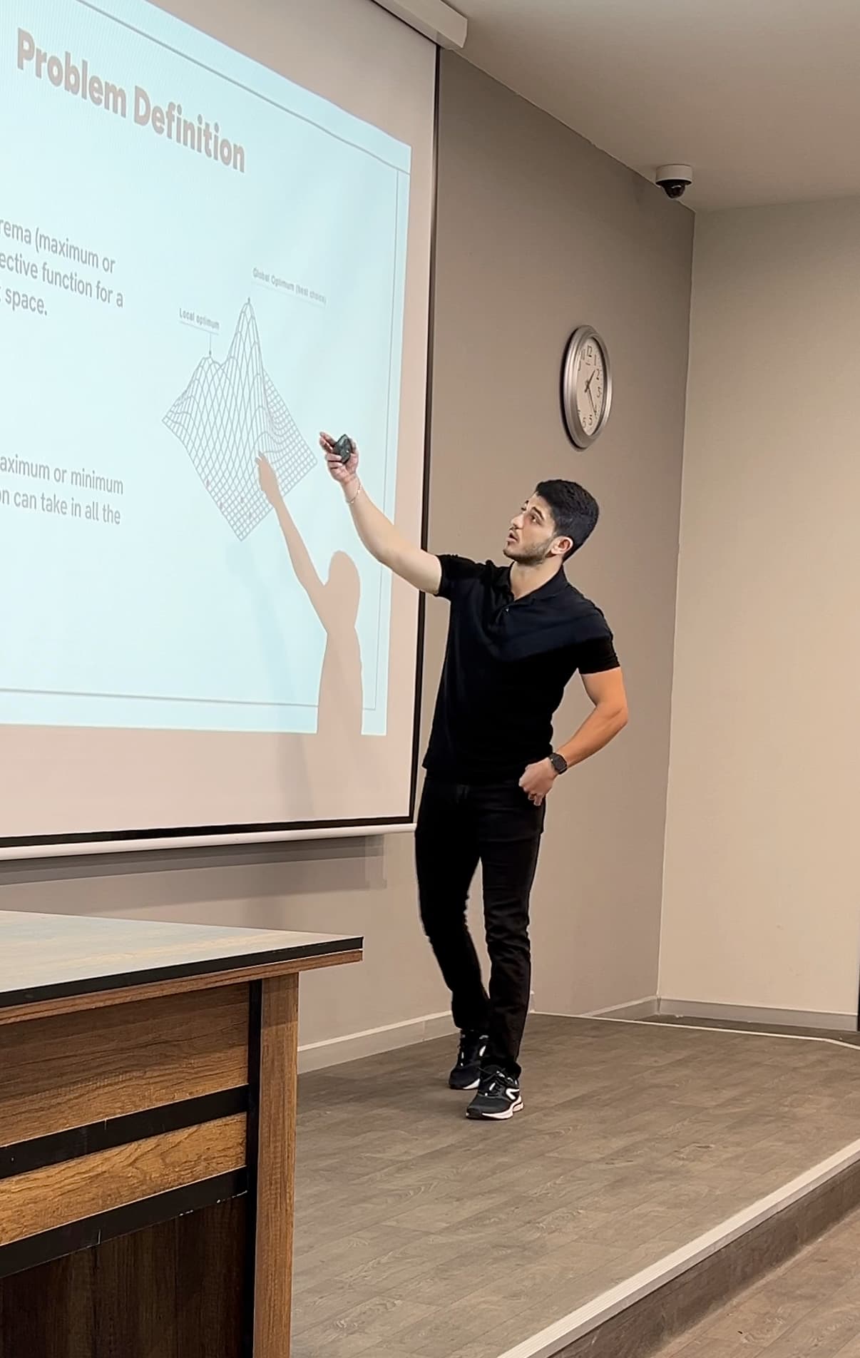 Me presenting our thesis project at the university
